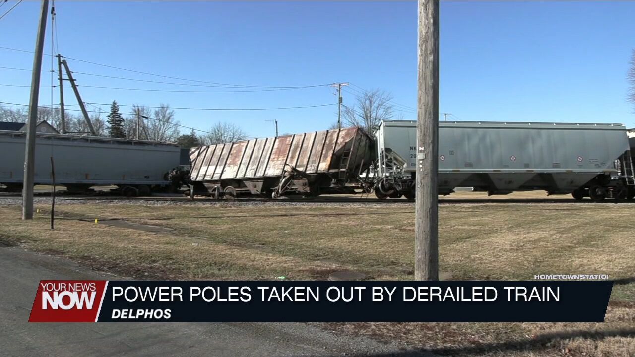 Train derails in Delphos taking out power poles along the tracks